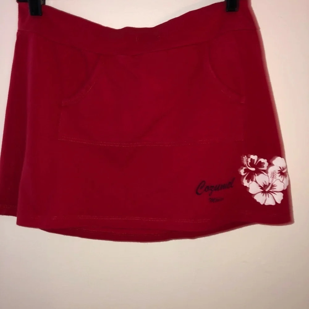 Chrysalis ladies red pocket mini skirt with Cozumel Mexico logo w/white hibiscus